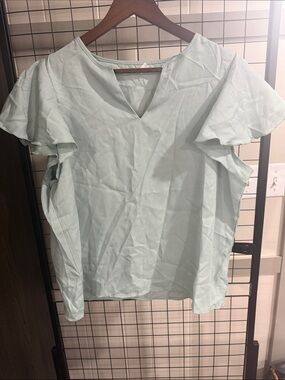 Ruffled Sleeve Women’s Blouse. Runs a little small fits like a Large